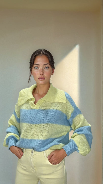 Woman modeling Josephine yellow and blue striped knit sweater with wide collar and cream pants